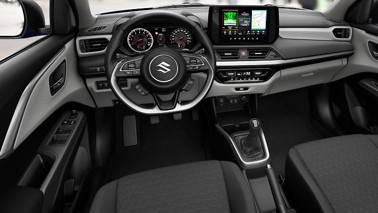 The cockpit of the new Swift combines black and gray plastics.  The central touchscreen offers a 9-inch screen area.