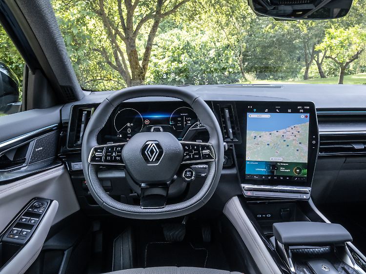 The Renault Espace has a modern interior with large display areas and few buttons.