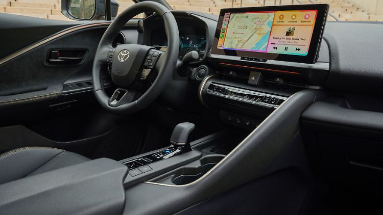A large, central 12.3-inch touchscreen characterizes the interior design.
